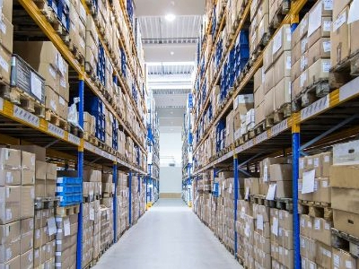 Warehouse aisle of racks filled with boxes