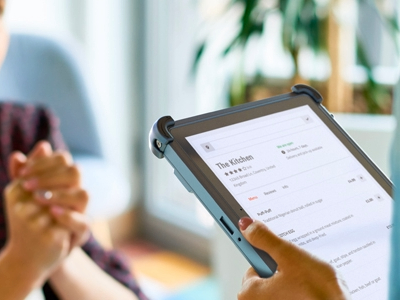 Waitress holding rugged tablet to take customer order